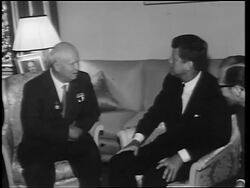 B/W 1960s John Kennedy + Nikita Khrushchev sitting in chairs talking / Germany / newsreel Stock Footage