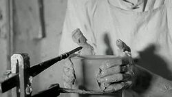TS Potter molding clay on a wheel Stock Footage