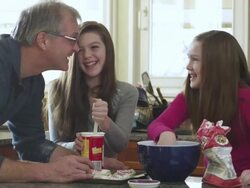 MS Father with daughters preparing cookies in kitchen / Rutland,Vermont, USA Stock Footage
