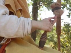 woman spins the thread of yarn Stock Footage