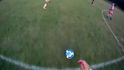 A soccer player dribbles the ball and makes a shot on goal. Stock Footage