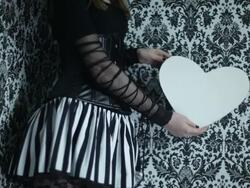 girl with black-and-white heart from paper Stock Footage