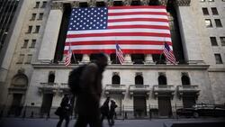 An American flag hangs outside the New York Stock Exchange. Stock Footage