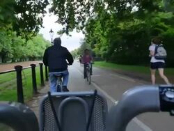 POV WS Hire bike riding through Hyde Park London Stock Footage