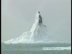 CU melting icicle, icy outcrop, ice floes, edited sequence, Arctic Circle Stock Footage
