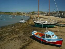 T/L tide coming in past moored boats, Scilly Isles, Cornwall, United Kingdom Stock Footage
