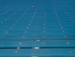 LA WS PAN Man sitting alone in empty bleachers / Homestead, FL, USA Stock Footage
