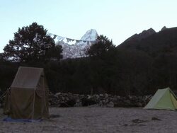 Tents in the Himalayas with Ama Dablam in the distance. Stock Footage