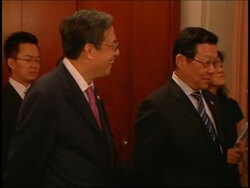 US and China officials at signing of trading act News Clip