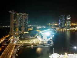 The Helix Bridge and Marina Bay Sands Singapore. Marina Bay, Singapore Stock Footage