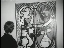 Art patrons examine a variety of Picasso's works at a 75th anniversary retrospective. News Clip