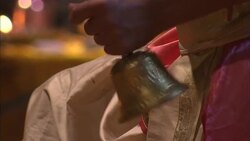 A monk rings bells during a puja ritual for Diwali. Stock Footage