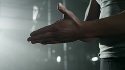 Man putting chalk on his hands in gym Stock Footage