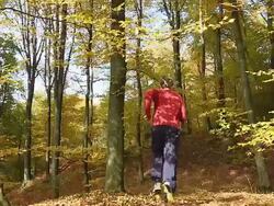 HD DOLLY SLOW MOTION: Young Man Jumping Over Camera Stock Footage