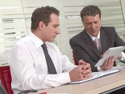 HD: Executives Using Digital Tablet For Business Stock Footage