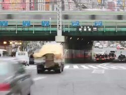 WS T/L View of busy street with traffic near Shinjuku station / Shibuya, Tokyo, Japan Stock Footage