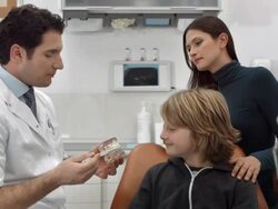 HD DOLLY: Dentist Teaching A Boy How To Brush Teeth Stock Footage