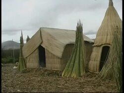 Straw huts in village, Lake Titicaca, MS, Peru Stock Footage