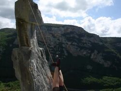 Young woman pulls herself across Tyrolean traverse Stock Footage