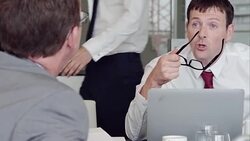Businessman talking at laptop in meeting Stock Footage