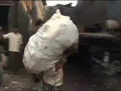 Recycling of plastic bags in Mumbai slum Stock Footage
