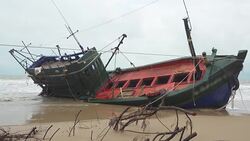 Fisherman boat aground in Thailand Stock Footage