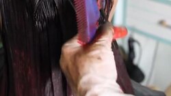 Professional Hairdresser Bleaching Girl's Hair Stock Footage