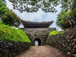 Tourist entering and exiting from Namhansanseong Castle Seomun Gate (Korea Historic Place 57, UNESCO World Heritage Sites) Stock Footage