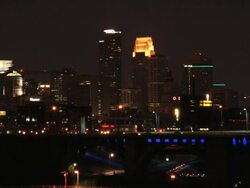 A night shot of the Minneapolis skyline as seen from across the Mississippi River from the campus of the University of Minnesota  Stock Footage