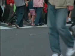 mcu pan right, following feet walking across pedestrian crossing, including pair of turquoise extreme platform shoes, Japan Stock Footage