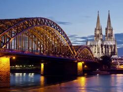 WS ZI T/L View of Hohenzollern Bridge with Cologne Cathedral and Rhine river at dusk / Cologne, North Rhine Westphalia, Germany    Stock Footage