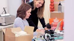 Fashion buyers working at desk in office Stock Footage