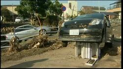 Survivors begin cleaning up damaged homes following tsunami News Clip