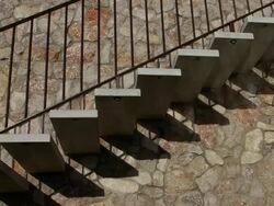 T/L Outside staircase with shadows moving across the wall Stock Footage
