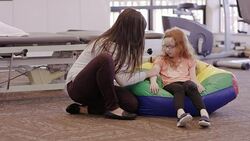 Female occupational therapist working with child patient Stock Footage