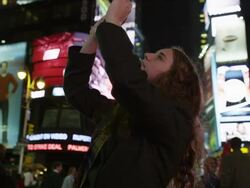 MS Teenage girl photographing on Time Square at night / Manhattan, New York City, New York State, USA Stock Footage