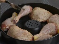 Raw chicken legs in pan Stock Footage