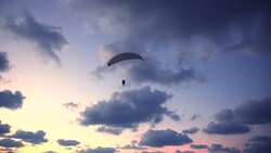 Paraplane in the sky before a sunset Stock Footage