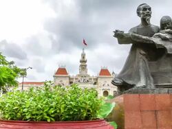 MS T/L PAN Shot of Ho Chi Minh City Hall with statue / Ho Chi Minh City, Southeastern, Vietnam Stock Footage