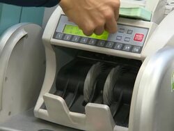 Bill counting machine counting one hundred euro bills Stock Footage
