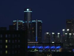 MS PAN Shot of downtown skyline at night with ford field, General Motors Renaissance Center, and Fox Theatre / Detroit, Michigan, United States Stock Footage