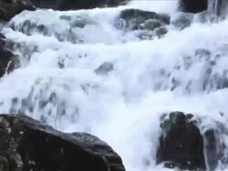 Zoom out on waterfall; Wales, UK Stock Footage