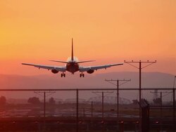HD airplane landing at sunset Stock Footage
