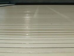 Swimming pool roller shutter opens showing house reflection on water Stock Footage