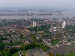 Aerial wide shot pan Woolwich area on the Thames / London, England Stock Footage