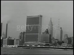 1951: NEW YORK CITY: MANHATTAN: MIDTOWN: XWS General Assembly building flanked by United Nations Secretariat tower building (officially international territory) w/ East River FG. Angled MS Windows of U.N. Secretariat Building. Instructional Video