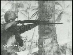 1944: BATTLE OF ENIWETOK: VS 22nd Marine Division advancing inland on Enjebi islet, smoke in BG, soldiers firing rifle, soldiers &amp; M4 Sherman tanks advancing. World War II, WWII, Pacific Front, aka Enewetak, Marshall Islands Campaign Instructional Video