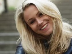 woman looking at the camera and smiling Stock Footage