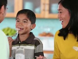 MS PAN Family Eating Dinner Together in Kitchen / Richmond, Virginia, USA Stock Footage
