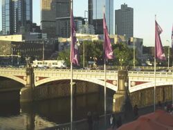 Setting Sun falling on Princess Bridge across the Yarra River, Melbourne, Victoria, Australia Stock Footage